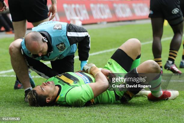 Luther Burrell of Northampton Saints receives treatment from the medical team during the Aviva Premiership match between Wasps and Northampton Saints...