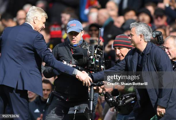 Arsene Wenger, Manager of Arsenal shakes hands with Jose Mourinho, Manager of Manchester United prior to the Premier League match between Manchester...