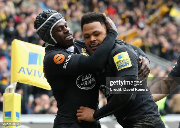 Juan de Jongh of Wasps is congratulated by team mate Christian Wade after scoring a try during the Aviva Premiership match between Wasps and...