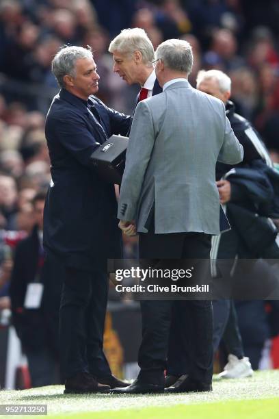 Sir Alex Ferguson and Jose Mourinho, Manager of Manchester United greet Arsene Wenger, Manager of Arsenal pitchside prior to the Premier League match...