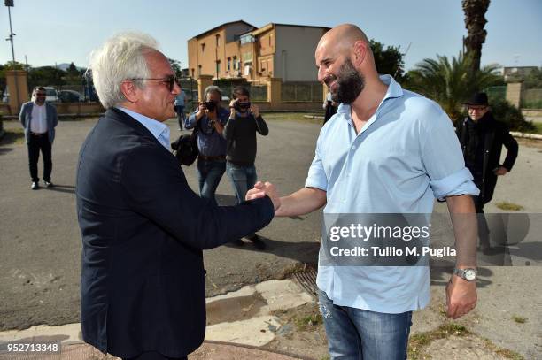 President Giovanni Giammarva and Roberto Stellone, new head coach of US Citta' di Palermo, shake hands after a press conference at Carmelo Onorato...