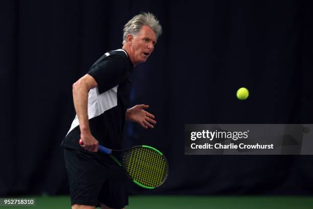 Rob Booth in action during The Lawn Tennis Association celebratory 50 years of Open Era tennis at the West Hants Club in Bournemouth, back where the...