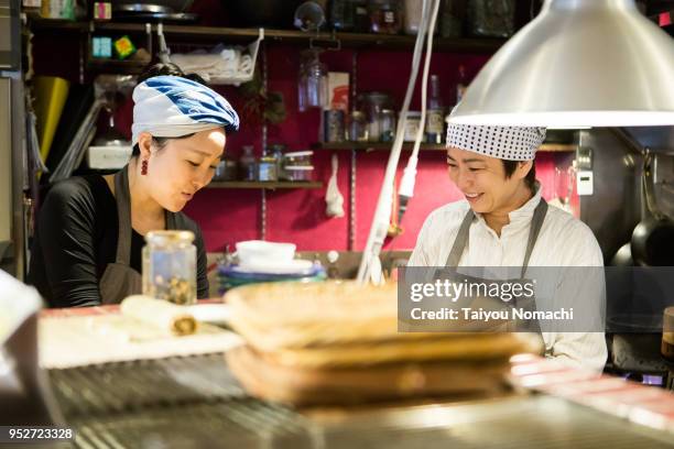 cooking person preparing for opening - woman smiling facing down stock pictures, royalty-free photos & images