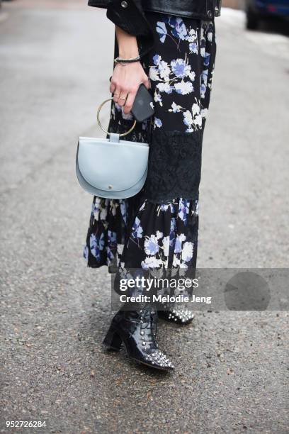 Nina Sandbech wears a By TiMo black floral dress and a Theory bag on January 26, 2018 in Oslo, Norway.