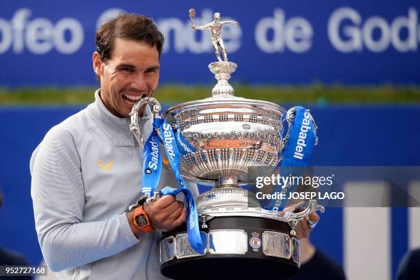 Spain's Rafael Nadal poses with his trophy after winning the Barcelona Open ATP tournament final tennis match in Barcelona on April 29, 2018.