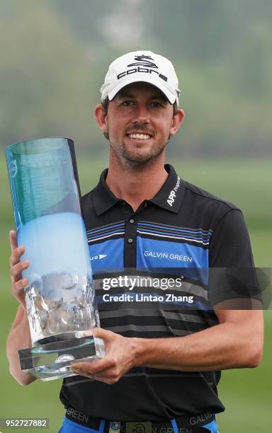 Alexander Bjork of Sweden holds the trophy celebrates after winning the 2018 Volvo China Open at Topwin Golf and Country Club on April 29, 2018 in...