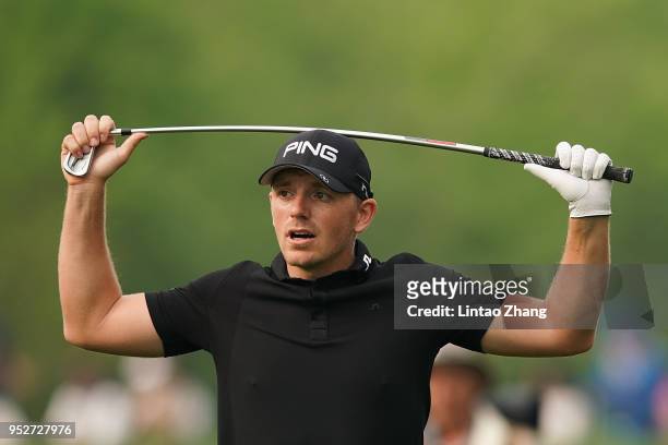 Matt Wallace of England reacts after the plays a shot during the final round of the 2018 Volvo China Open at Topwin Golf and Country Club on April...