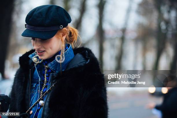Model Helene Hammer wears a blue newsboy cap and Michael Olestad earrings on January 26, 2018 in Oslo, Norway.