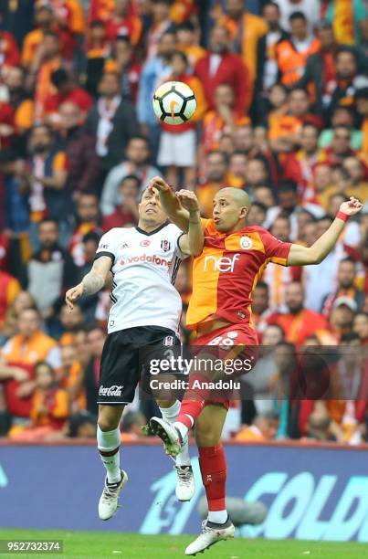 Sofiane Feghouli of Galatasaray in action against Adriano Correia of Besiktas during Turkish Super Lig soccer match between Galatasaray and Besiktas...