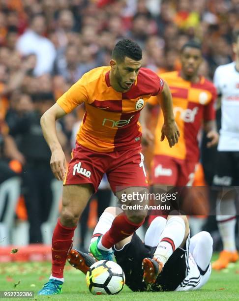Younes Belhanda of Galatasaray in action against Gary Medel of Besiktas during Turkish Super Lig soccer match between Galatasaray and Besiktas at...