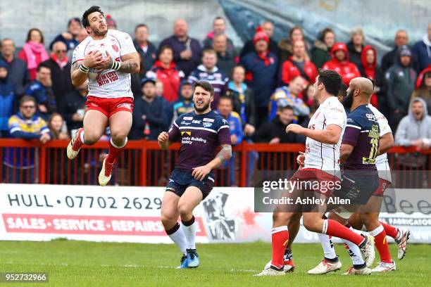 Justin Carney of Hull KR jumps up to collect the ball during the BetFred Super League match between Hull KR and Leeds Rhinos at KCOM Craven Park on...