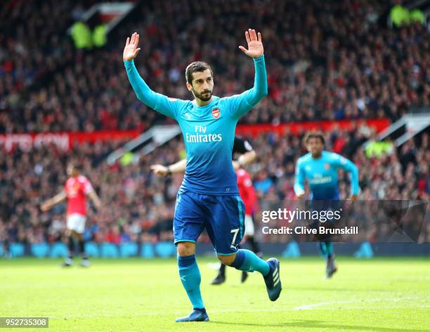 Henrikh Mkhitaryan of Arsenal celebrates after scoring his sides first goal during the Premier League match between Manchester United and Arsenal at...