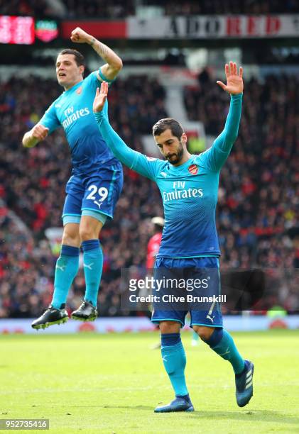 Henrikh Mkhitaryan of Arsenal celebrates after scoring his sides first goal with Granit Xhaka of Arsenal during the Premier League match between...