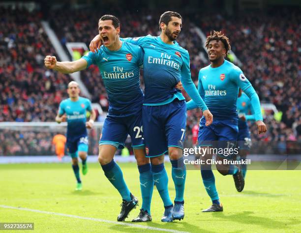 Henrikh Mkhitaryan of Arsenal celebrates after scoring his sides first goal with Granit Xhaka of Arsenal and Alex Iwobi of Arsenal during the Premier...