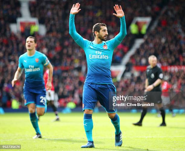 Henrikh Mkhitaryan of Arsenal celebrates after scoring his sides first goal during the Premier League match between Manchester United and Arsenal at...