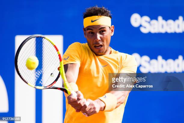 Rafael Nadal of Spain plays a backhand against Stefanos Tsitsipas of Greece in their final match during day seven of the Barcelona Open Banc Sabadell...
