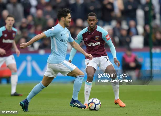 Ilkay Gundogan of Manchester City and Edimilson Fernandes of West Ham United during the Premier League match between West Ham United and Manchester...