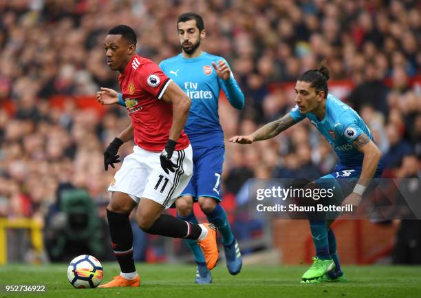 Anthony Martial of Manchester United attempts to get away from Henrikh Mkhitaryan of Arsenal and Hector Bellerin of Arsenal during the Premier League...