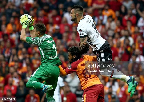 Muslera and Jason Denayer of Galatasaray in action against Alvaro Negredo of Besiktas during Turkish Super Lig soccer match between Galatasaray and...