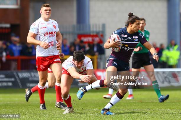 Ashton Golding of Leeds Rhinos gets away from Chris Clarkson of Hull KR during the BetFred Super League match between Hull KR and Leeds Rhinos at...