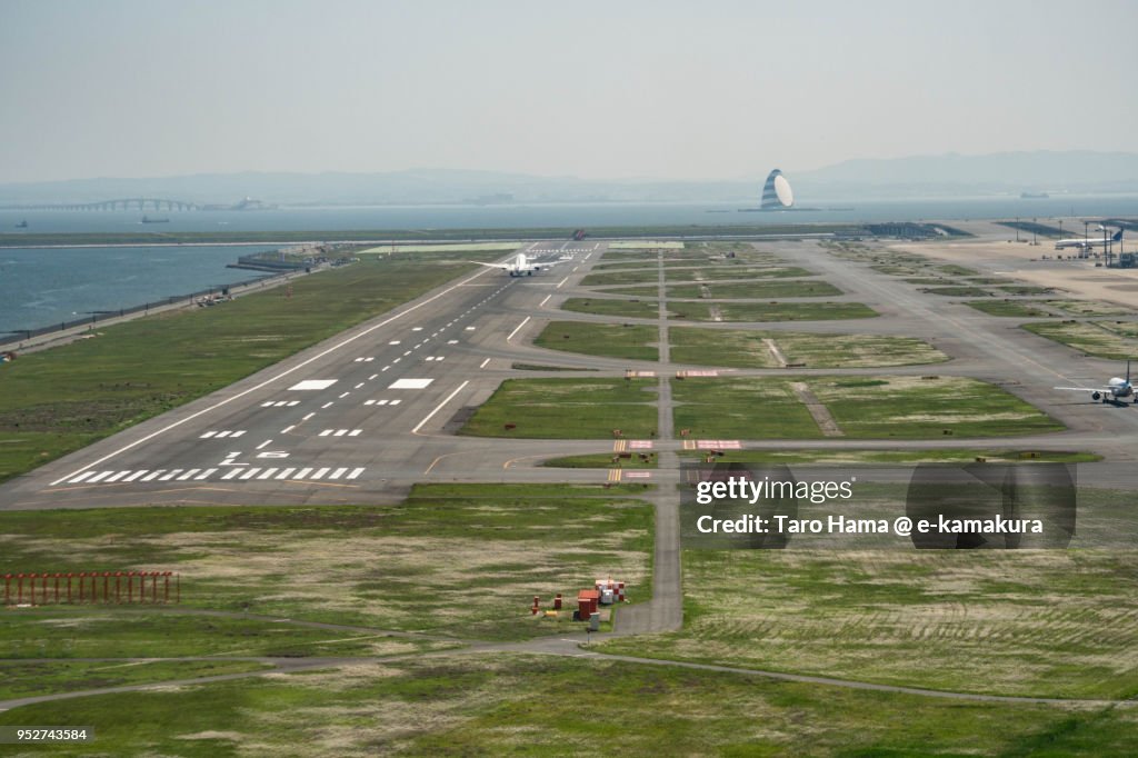 Tokyo Haneda International Airport in Tokyo in Japan daytime aerial view from airplane