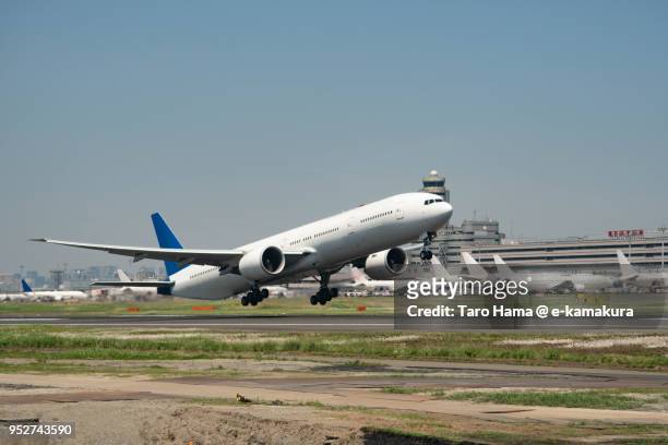 the airplane taking off "a" runaway of tokyo haneda international airport in tokyo in japan daytime aerial view from airplane - airplane take off stock pictures, royalty-free photos & images