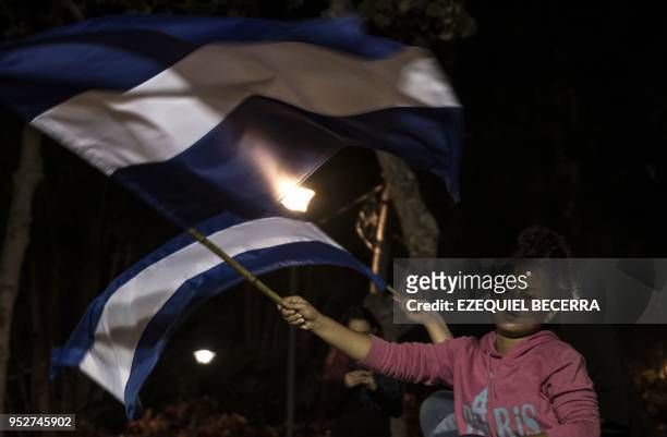 Nicaraguan inmigrants living in Costa Rica demonstrate in support of Nicaraguans protesting against government's pension reforms during a vigil at...