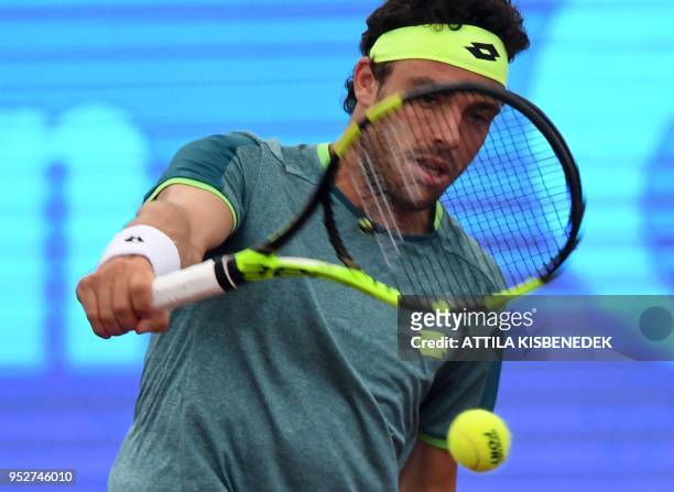 Italian Marco Cecchinato returns the ball to Australian John Millman during heir ATP final tennis match at the Hungarian Open in Budapest, on April...