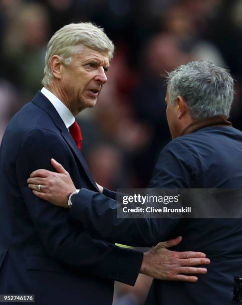 Arsene Wenger, Manager of Arsenal shakes hands with Jose Mourinho, Manager of Manchester United during the Premier League match between Manchester...