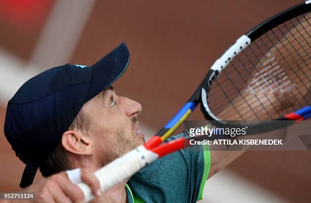 Australian John Millman serves to Italian Marco Cecchinato during their ATP final tennis match at the Hungarian Open in Budapest, on April 29, 2018.