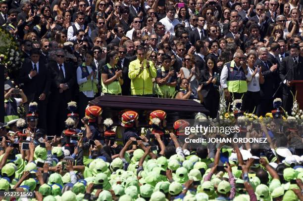 The coffin of Guatemala City Mayor and former Guatemalan President Alvaro Arzu is escorted by military personnel during his funeral as they arrive to...