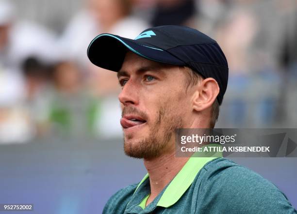 Australian John Millman reacts after a point against Italian Marco Cecchinato during their ATP final tennis match at the Hungarian Open in Budapest,...