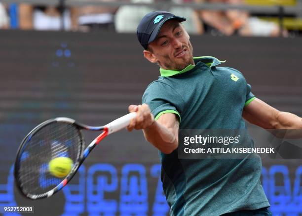 Australian John Millman returns the ball to Italian Marco Cecchinato during their ATP final tennis match at the Hungarian Open in Budapest, on April...