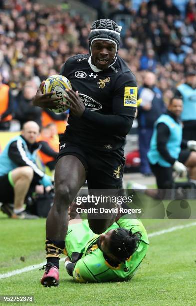 Christian Wade of Wasps breaks clear to score his second try during the Aviva Premiership match between Wasps and Northampton Saints at The Ricoh...