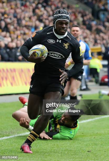Christian Wade of Wasps breaks clear to score his second try during the Aviva Premiership match between Wasps and Northampton Saints at The Ricoh...