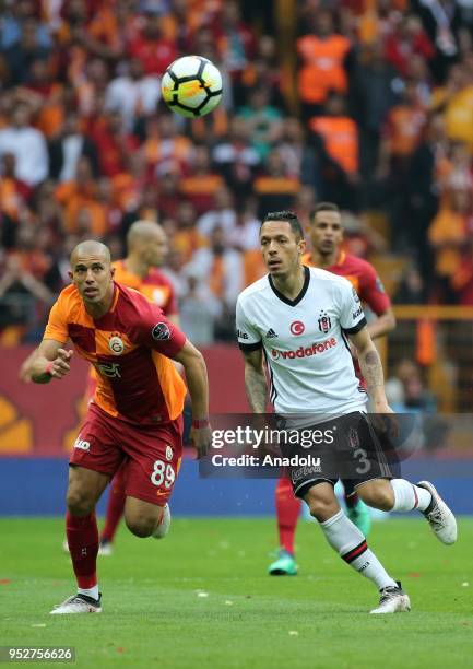 Feghouli of Galatasaray in action against Adriano of Besiktas during Turkish Super Lig soccer match between Galatasaray and Besiktas at Turk Telekom...
