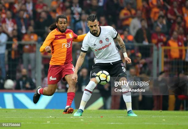 Jason Denayer of Galatasaray in action against Alvaro Negredo of Besiktas during Turkish Super Lig soccer match between Galatasaray and Besiktas at...