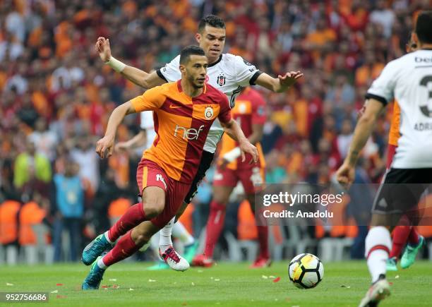 Belhanda of Galatasaray in action against Pepe of Besiktas during Turkish Super Lig soccer match between Galatasaray and Besiktas at Turk Telekom...