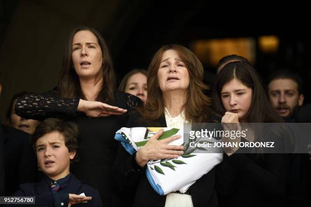 Patricia Escobar , widow of former Guatemalan President and Guatemala City Mayor, Alvaro Arzu, next to their relatives, grieve during his funeral at...