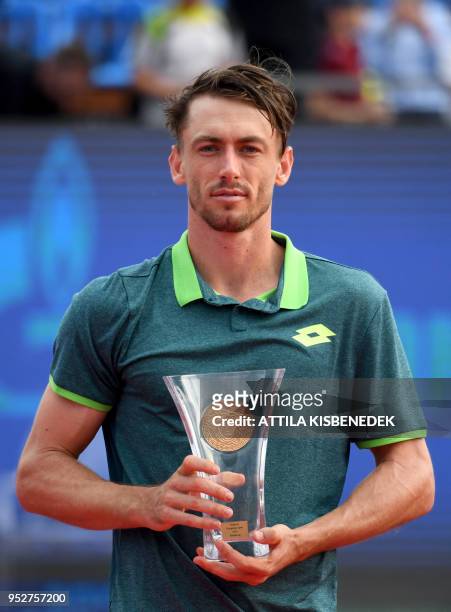 Australian John Millman poses with his trophy after he finished second at the Hungarian Open in Budapest, on April 29, 2018 following hist ATP final...