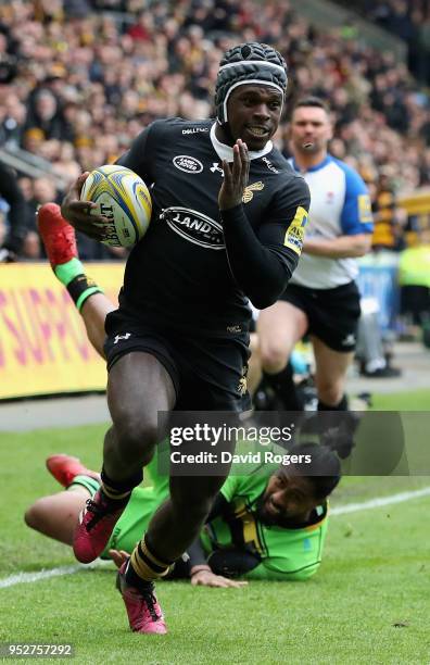 Christian Wade of Wasps breaks clear to score his second try during the Aviva Premiership match between Wasps and Northampton Saints at The Ricoh...