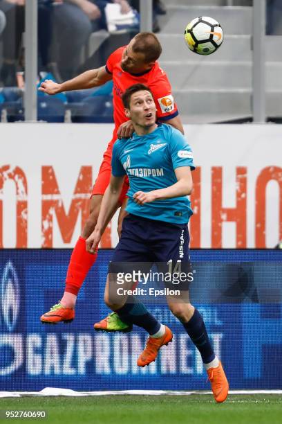 Daler Kuzyaev of FC Zenit Saint Petersburg and Vasili Berezutski of PFC CSKA Moscow vie for the ball during the Russian Football League match between...