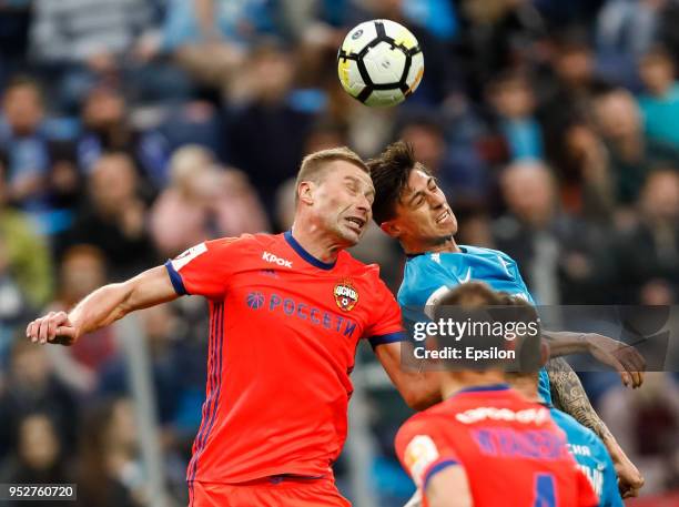 Emiliano Rigoni of FC Zenit Saint Petersburg and Aleksei Berezutski of PFC CSKA Moscow vie for a header during the Russian Football League match...