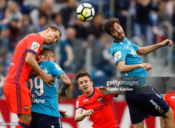 Aleksandr Erokhin and Anton Zabolotny of FC Zenit Saint Petersburg vie for the ball with Sergei Ignashevich and Aleksandr Golovin of PFC CSKA Moscow...