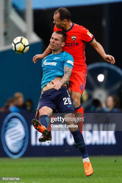 Anton Zabolotny of FC Zenit Saint Petersburg and Sergei Ignashevich of PFC CSKA Moscow vie for the ball during the Russian Football League match...