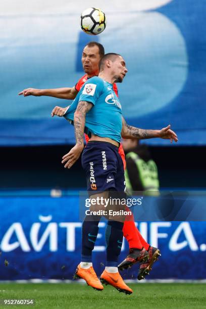 Anton Zabolotny of FC Zenit Saint Petersburg and Sergei Ignashevich of PFC CSKA Moscow vie for a header during the Russian Football League match...