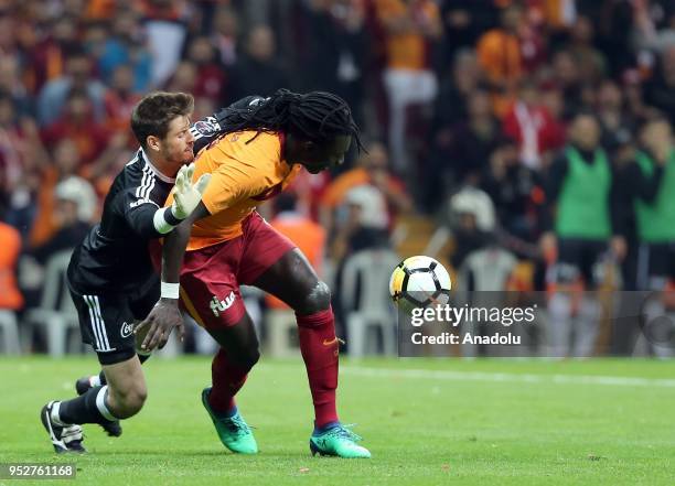 Bafetimbi Gomis of Galatasaray in action against Fabri of Besiktas during Turkish Super Lig soccer match between Galatasaray and Besiktas at Turk...