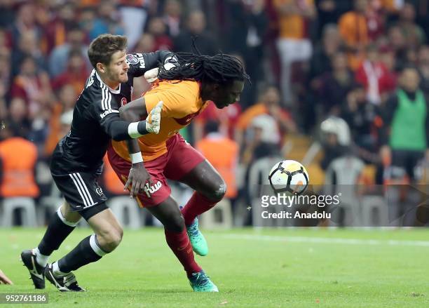 Bafetimbi Gomis of Galatasaray in action against Fabri of Besiktas during Turkish Super Lig soccer match between Galatasaray and Besiktas at Turk...