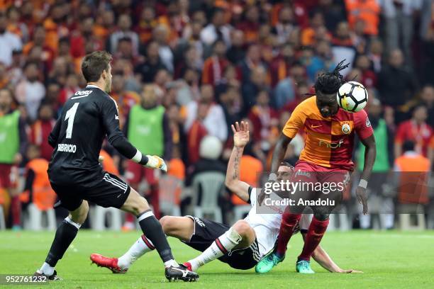 Bafetimbi Gomis of Galatasaray in action against Fabri and Tosic of Besiktas during Turkish Super Lig soccer match between Galatasaray and Besiktas...