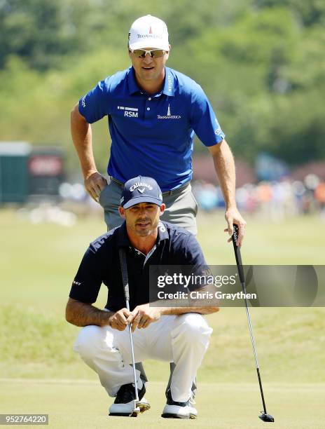 Jonathan Byrd and Zach Johnson line up a putt on the first hole during the final round of the Zurich Classic at TPC Louisiana on April 29, 2018 in...